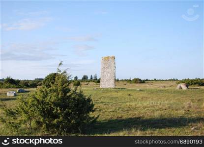 Standing stone, an ancient monument in a great plain grassland at the swedish island Oland