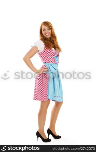 standing young redhead woman in bavarian dress. standing young redhead woman in bavarian dress on white background