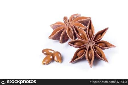Star anise spice fruits and seeds isolated on white