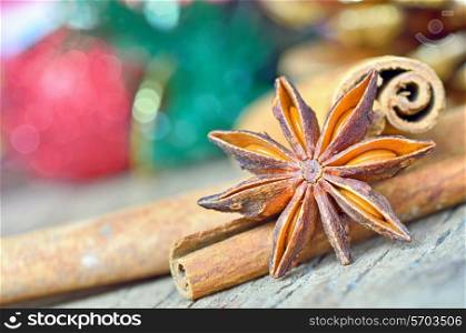 Star anise with cinnamon at christmas time on wold wooden background