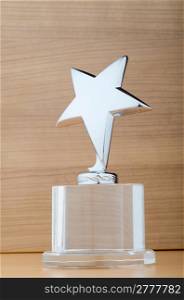 Star award against wooden background