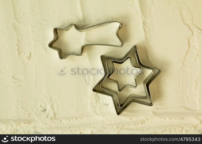 Star molds for making cookies on sifted flour