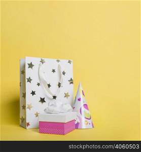 star shape shopping bag paper hat gift box yellow background