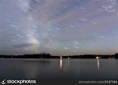 Star trails over a lake, Lake of The Woods, Ontario, Canada