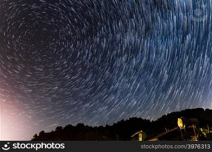 Star Trails round the polar star and over a house at the Troodos mountains in Kakopetria village in Cyprus