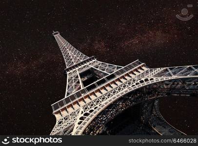 Starry night over Eiffel Tower . At night, under the light of stars.