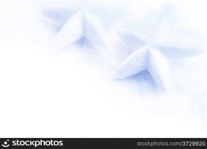 stars christmas decoration in white snow isolated