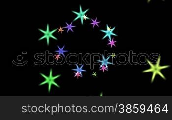 Stars fly on a black background being built in a circle