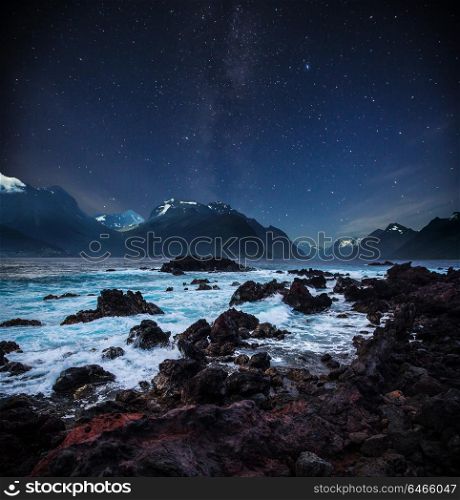 stars shine in the sky over the fjords. Milky Way