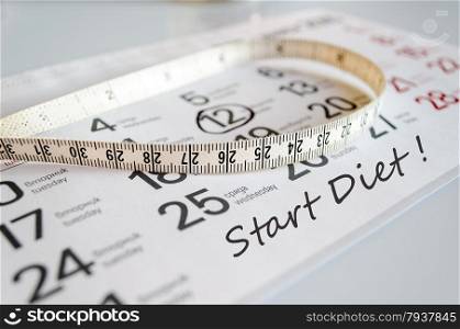 Start Diet Concept - Tape Measure On Calendar
