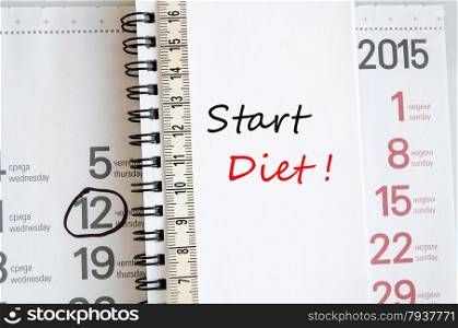 Start Diet Concept - Tape Measure On Calendar And Notebook