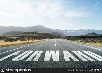 Start new way right here. Conceptual image with word forward on asphalt road