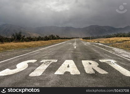 Start new way right here. Conceptual image with word start on asphalt road