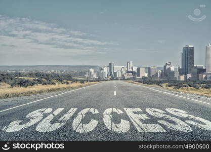 Start new way right here. Conceptual image with word success on asphalt road