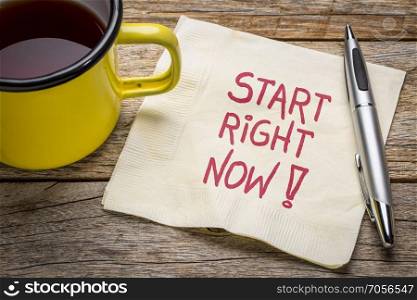 Start right now - motivational note on napkin with a cup of tea