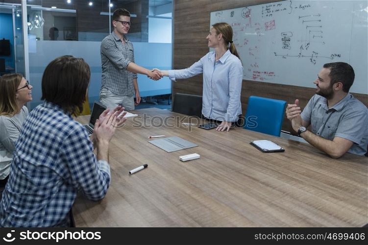 start up business people handshake on team meeting at modern business office interior