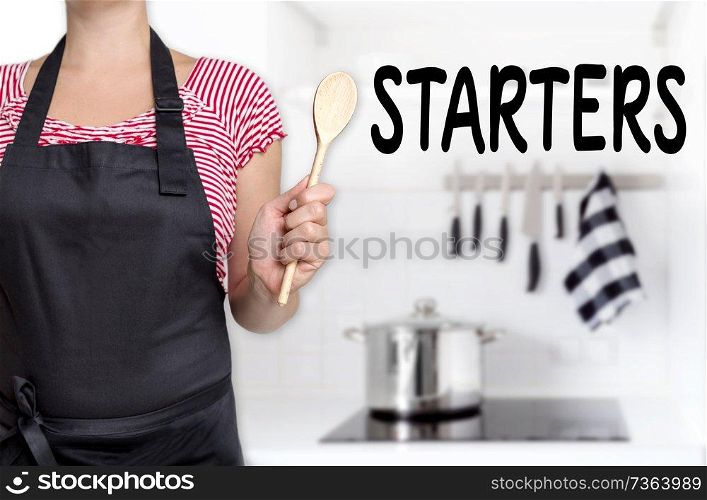 starters cook holding wooden spoon background.. starters cook holding wooden spoon background