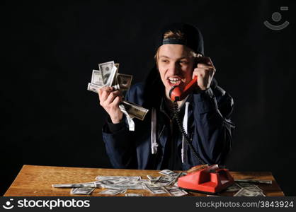 startled man with phone on the dark background