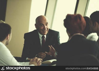 startup business people group have meeting in modern bright office interior, senior investors and young software developers discuss about plans and projects