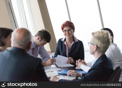 startup business people group have meeting in modern bright office interior, senoir investors and young software developers