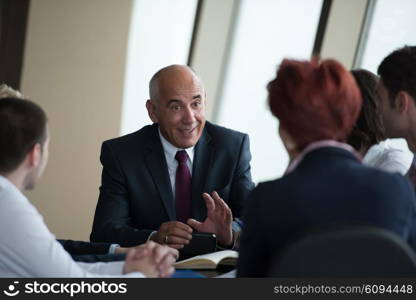 startup business people group have meeting in modern bright office interior, senoir investors and young software developers