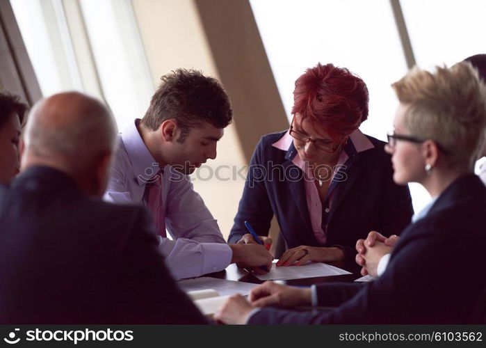 startup business people group have meeting in modern bright office interior, senoir investors and young software developers sign contract