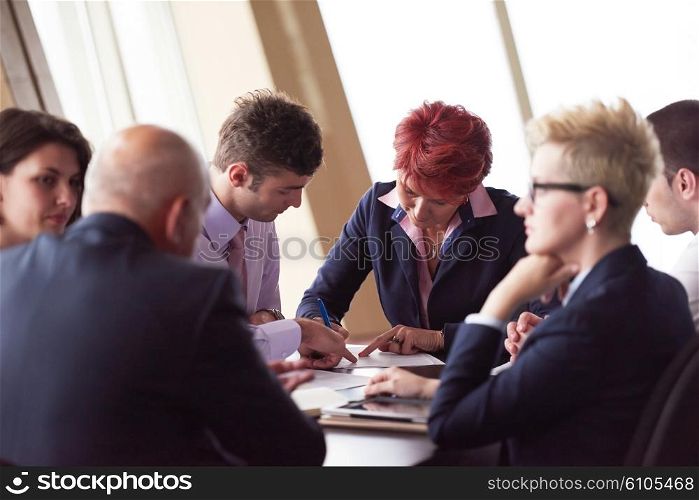 startup business people group have meeting in modern bright office interior, senoir investors and young software developers sign contract