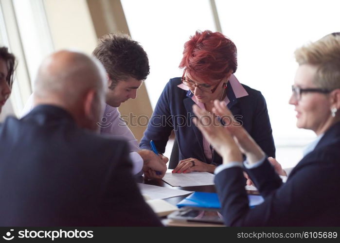 startup business people group have meeting in modern bright office interior, senoir investors and young software developers sign contract