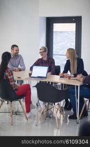 startup business team on meeting in modern bright office interior brainstorming, working on laptop and tablet computer