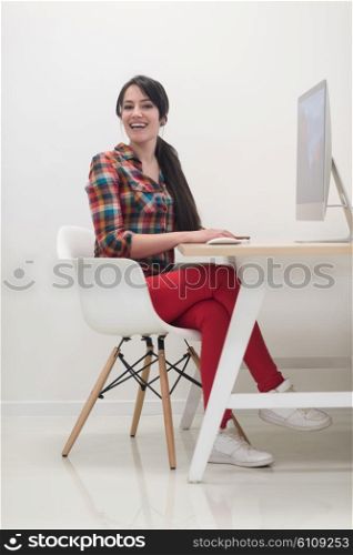 startup business, woman working on dektop computer at creative modern office relaxing and have fun