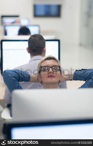 startup business, woman working on dektop computer at creative modern office relaxing and have fun