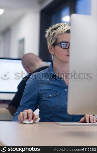 startup business, woman working on dektop computer at creative modern office relaxing and have fun
