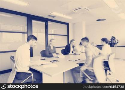 startup business young creative people group entering meeting room with motion blur modern office interior