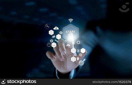 Startup concept. Businessman touching icon start up and icon network connection on modern virtual interface