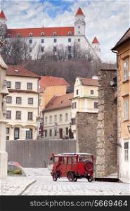Stary Hrad - ancient castle and vintage car on old street in Bratislava, Slovakia&#xA;