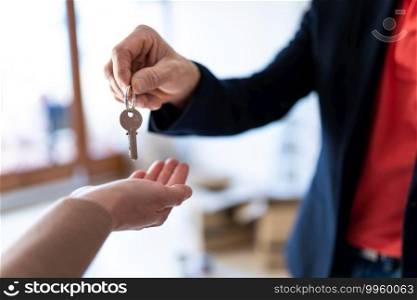 State agent giving keys to a new lady’s house