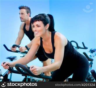 Stationary spinning bicycles fitness girl in a gym sport club