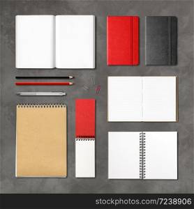 stationery books and notebooks mockup template isolated on concrete background. stationery books and notebooks on a concrete background