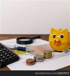 stationery items piggy bank with money
