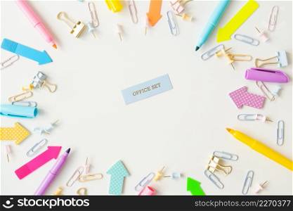 Stationery, school supplies on a white table in bright pastel colors. Inscription. Stationery, school supplies on a white table in bright pastel colors. Inscription.