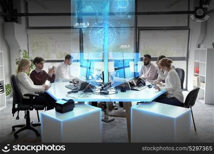 statistics, technology and people concept - business team with smartphones, computers and virtual screen projections networking at office. business team with computers working at office