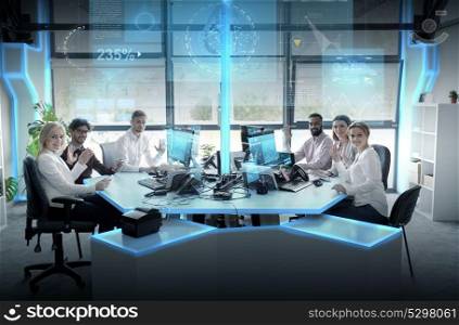 statistics, technology and people concept - business team with smartphones, computers and virtual screens projections waving hands at office. business team at office with virtual screens