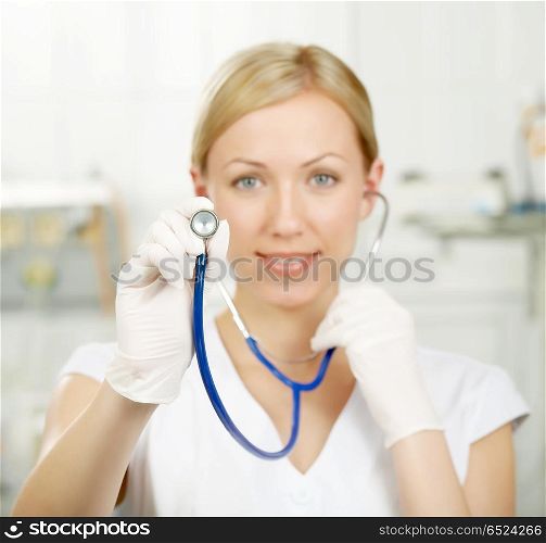 Statoscope. The woman the doctor stretches forward a statoscope