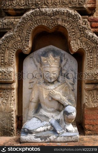 Statue Ananda on the wall of olkd temple in Bagan, Myanmar