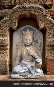 Statue Ananda on the wall of olkd temple in Bagan, Myanmar