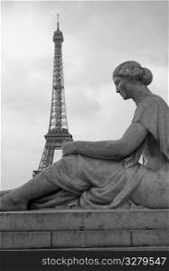 Statue and Eiffel Tower in Paris France