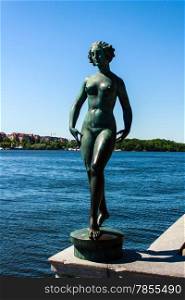 Statue at embankment near the City Hall in Stockholm, Sweden