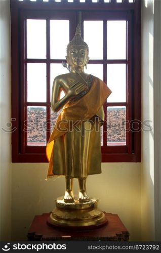 Statue Buddha in corridor of Loha Prasat in Bangkok, Thailand