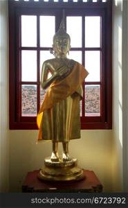 Statue Buddha in corridor of Loha Prasat in Bangkok, Thailand