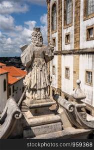Statue by the Biblioteca Joanina of the University of Coimbra. Johannine Library in main quadrangle of University of Coimbra